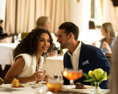 Couple dining at a table