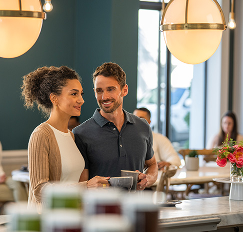 Couple drinking coffee at counter