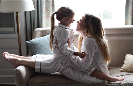 A couple holding hands in the foyer