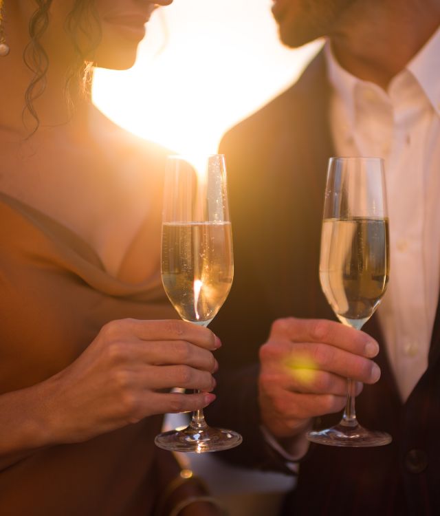 A couple holding champagne flutes