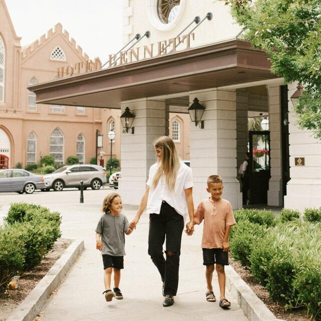 Mother and kids at hotel entrance